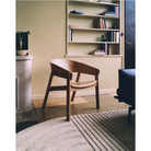 The Relevo Rug from Muuto in off white in a bedroom.