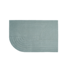 The large Relevo Rug from Muuto in sage green.