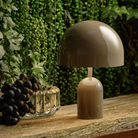 The Bell Portable LED from Tom Dixon on a bar.