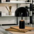 The Bell Portable LED from Tom Dixon in an office.