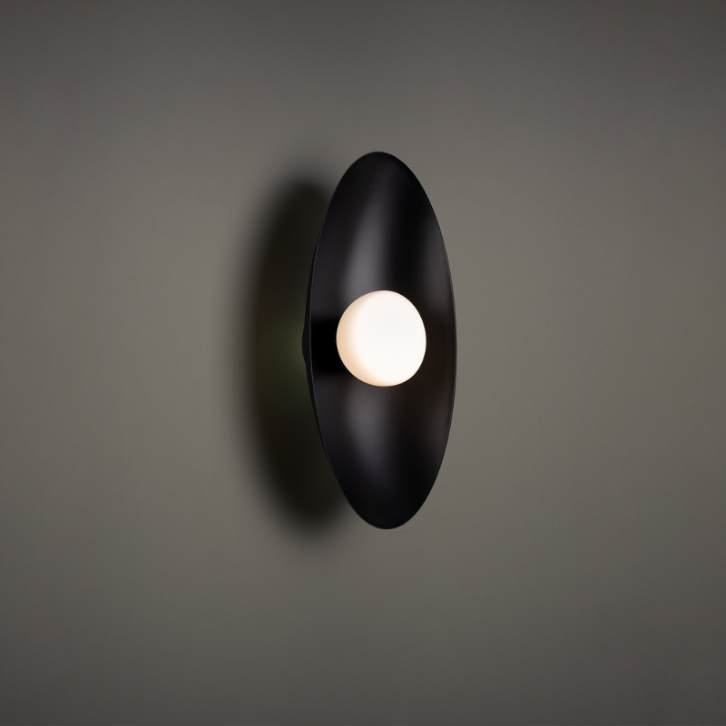 The Glamour Wall Sconce from WAC Lighting in a family area.