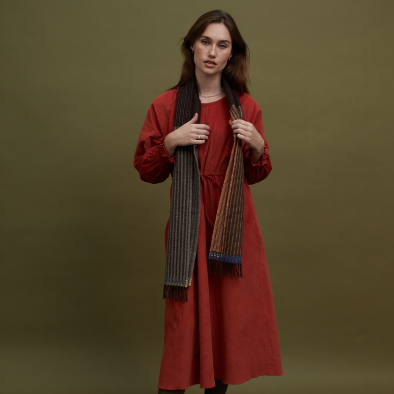 The Chatham Scarf from Wallace & Sewell in leather (color) lifestyle on a woman.