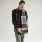 The Strathay Scarf from Wallace & Sewell in fog lifestyle on a man.