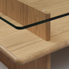 The Parallel Coffee Table from Woud made with oak and a glass top in detail.