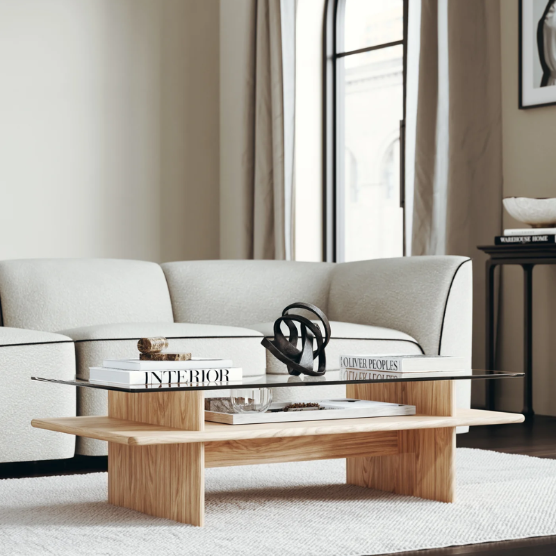 The rectangular Parallel Coffee Table from Woud made with oak and a glass top in a family room with the Flora Sofa.