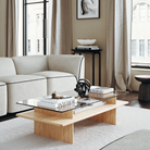 The rectangular Parallel Coffee Table from Woud made with oak and a glass top with the Flora Sofa.