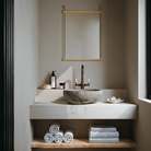 The small Suspended Mirror by Woud above a bathroom vanity.