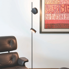 The Super O Floor Lamp from Zafferano in black in a living room.